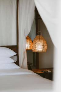 Cama ou camas em um quarto em Pousada Maravilha