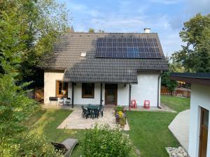a house with solar panels on the roof at INFINITA Bodice in Liptovský Mikuláš