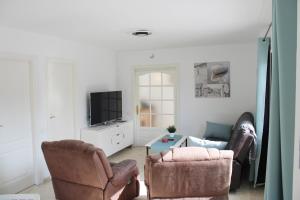 Televízia a/alebo spoločenská miestnosť v ubytovaní 3 bedroom penthouse