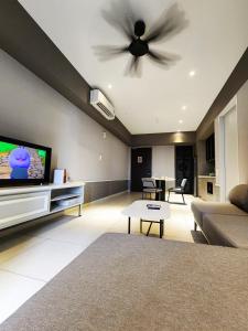 TV at/o entertainment center sa Millerz Square Suite by Define Suite