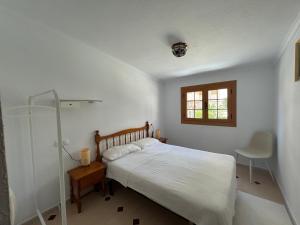 En eller flere senge i et værelse på Vistas de Cabomar