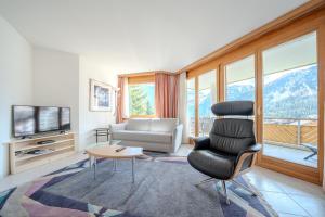 TV a/nebo společenská místnost v ubytování Casa Cresta C32 by Arosa Vacations