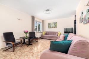 a living room with a couch and a table at Your Holidays Campingowa in Międzyzdroje