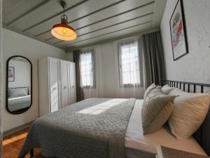 a bedroom with a large bed and a mirror at Meli Mila Spiti milozrooms Ayvalik in Ayvalık +68 photos