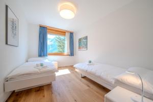 Postel nebo postele na pokoji v ubytování Casa Cresta C32 by Arosa Vacations
