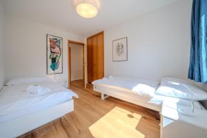 Postel nebo postele na pokoji v ubytování Casa Cresta C32 by Arosa Vacations