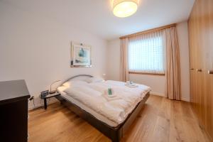 Postel nebo postele na pokoji v ubytování Casa Cresta C32 by Arosa Vacations