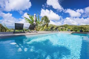 Villa KANOA - T2- classé 4 étoiles - Vue Mer - Piscine - SPA内部或周边的泳池