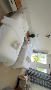 a room with a pile of pillows on the wall at Rida Village Ksamil Island in Ksamil