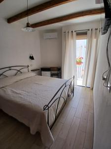 Postel nebo postele na pokoji v ubytování Monte Longu