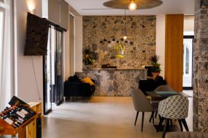 a living room with a table and chairs at MiraMar Hotel in Shëngjin