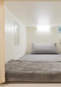Postel nebo postele na pokoji v ubytování Goodwill Holidays JBR
