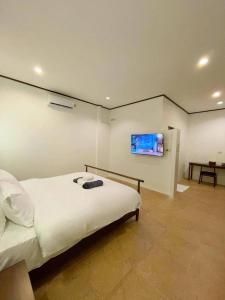 维维小屋别墅度假酒店客房内的一张或多张床位
