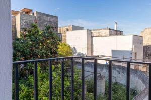 a view of a city from a balcony at Casa Caminari in Grottaglie