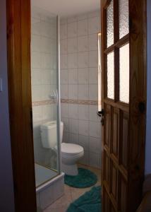 a bathroom with a toilet and a window at Ostoja Konarzewo in Pogorzelica +52 photos