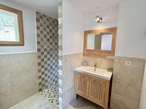 a bathroom with a sink and a mirror at Chalet 8 pièces avec spa, sauna, 15 pers, à 800m des pistes, Notre-Dame-de-Bellecombe - FR-1-595-1 in Notre-Dame-de-Bellecombe +27 photos