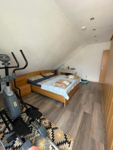 a bedroom with a bed and a gym at Gemütliches Haus im Herzen des Schwarzwaldes für bis zu 9 Personen in Elzach