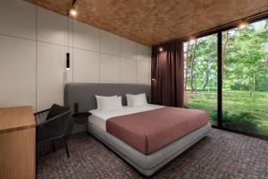 Postel nebo postele na pokoji v ubytování GOOD ZONE Hotel