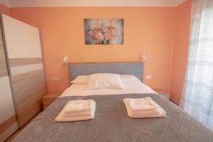 Postel nebo postele na pokoji v ubytování Apartment Ana