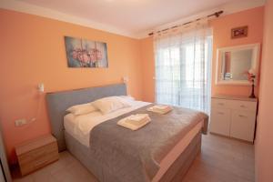 Postel nebo postele na pokoji v ubytování Apartment Ana