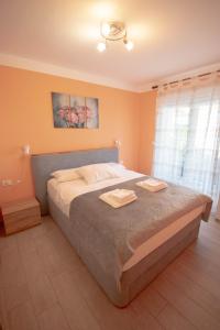 Postel nebo postele na pokoji v ubytování Apartment Ana