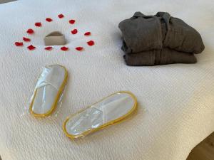 Łóżko lub łóżka w pokoju w obiekcie L’appartement du Fayé avec jacuzzi privé