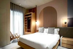 Ένα ή περισσότερα κρεβάτια σε δωμάτιο στο Locanda Expanificio