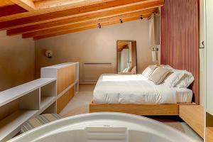 a bedroom with a bed and a bath tub at Locanda Expanificio in Agrigento