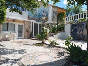 a house with a mural on the side of it at Apartman SIRENA in Pićan