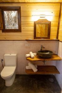 a bathroom with a sink and a toilet at Cabaña Tanzania in Tarifa
