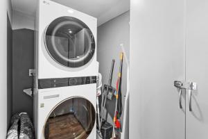a washer and a dryer in a room at Suite C Beach, Firepit, Dog-friendly, Downtown! in Biloxi