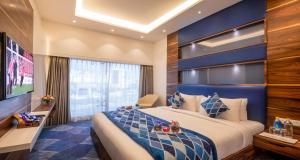 En eller flere senge i et værelse på SureStay by Best Western Model Town Amritsar