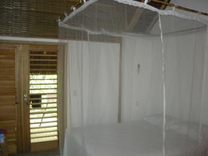 Łóżko lub łóżka w pokoju w obiekcie Bed & Breakfast Casa Dos Cajueiros