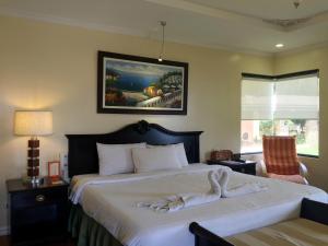 Tempat tidur dalam kamar di Villa Marinelli Bed and Breakfast