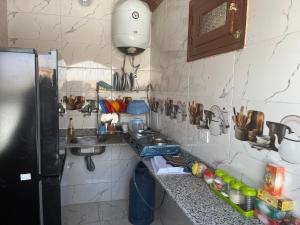 a kitchen with a sink and a counter top at Toto Kato in Jazīrat Aswān