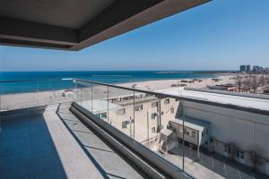 a view of the beach from the balcony of a building at Cazare Apartmente in SolidHouse Mamaia in Mamaia