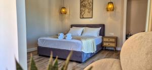 Ένα ή περισσότερα κρεβάτια σε δωμάτιο στο Cristina Apartments
