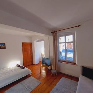 Ένα ή περισσότερα κρεβάτια σε δωμάτιο στο Studia CENTRUM