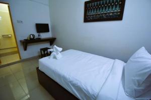 Postel nebo postele na pokoji v ubytování AZYA Hotel