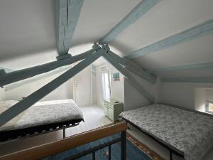 Postel nebo postele na pokoji v ubytování Bonvivan House