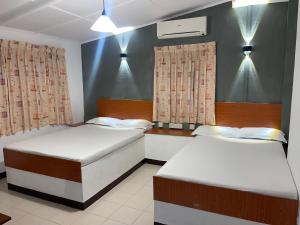 Postel nebo postele na pokoji v ubytování Selagala Resort