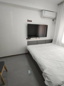 Postel nebo postele na pokoji v ubytování Little Mango Inn
