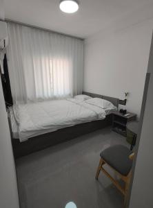 Postel nebo postele na pokoji v ubytování Little Mango Inn