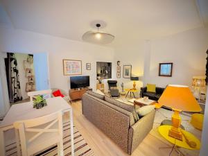 a living room with a couch and a table at Les Cactus #MaisonSavaron - 52m2 - Terrasse in Clermont-Ferrand