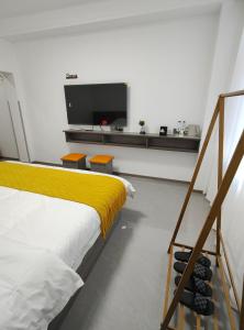 Postel nebo postele na pokoji v ubytování Little Mango Inn