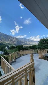 a balcony with a view of the mountains at Comfort Inn in Chitral