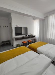 Postel nebo postele na pokoji v ubytování Little Mango Inn
