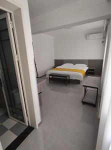 Postel nebo postele na pokoji v ubytování Little Mango Inn