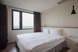 Ein Bett oder Betten in einem Zimmer der Unterkunft Shanmian Unmanned Hotel