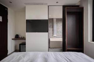 Ein Bett oder Betten in einem Zimmer der Unterkunft Shanmian Unmanned Hotel